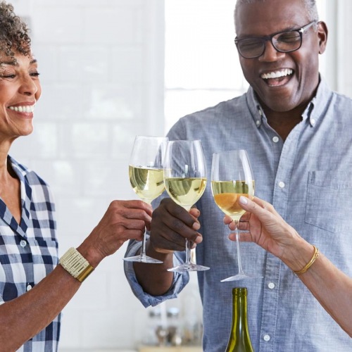 Settle into comfort at Hunter's Creek Apartments a few people toasting wine glasses